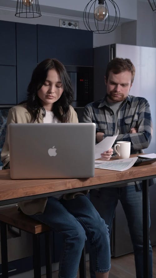 Couple Checking Bill Payments Through Online