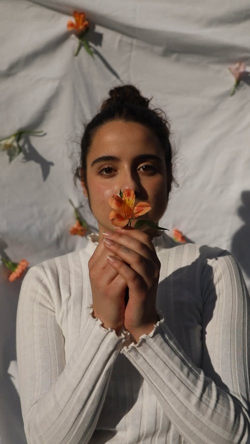 Woman Holding a Flower