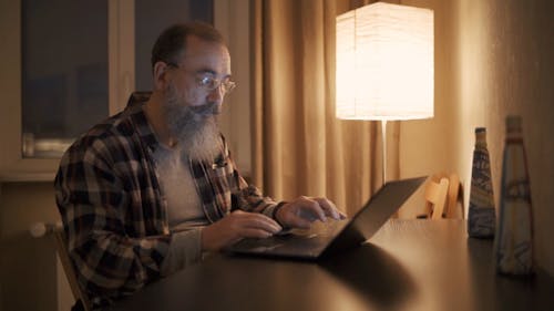 Elderly Man Working at Home