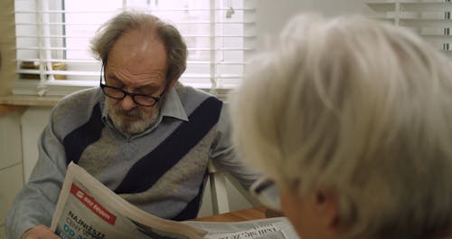 Elderly Man Reading Newspaper