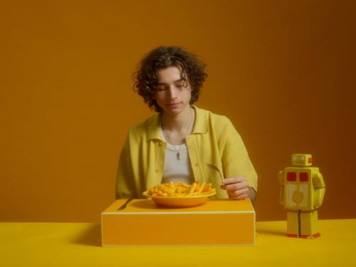 A Young Man Having A Snack