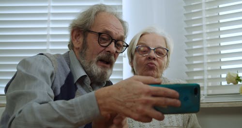 Elderly Couple Using a Cellphone