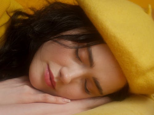 A Sleeping Girl Awaken By The Alarm Clock