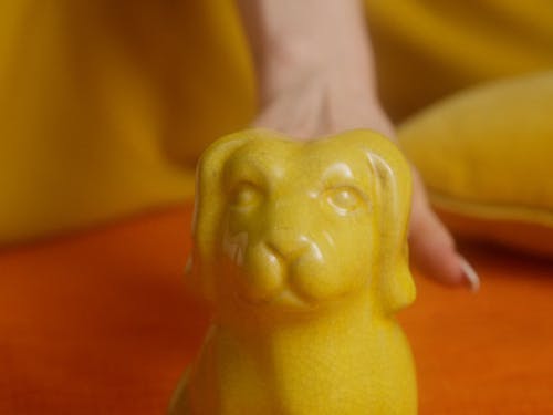 A Woman In Yellow Dress Posing For A Photoshoot