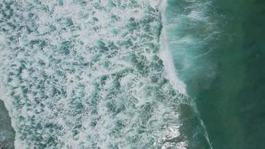 high angle shot of waves in the ocean