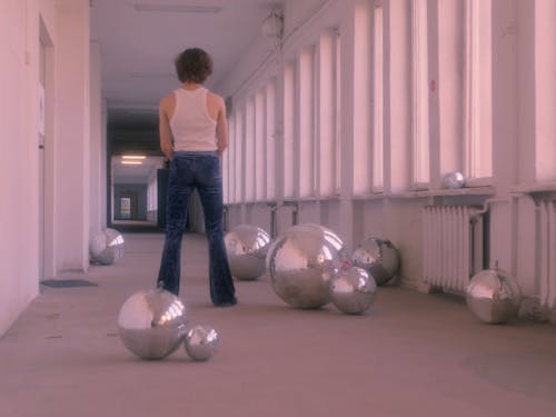 Push in Shot of a Man Standing in a Hallway