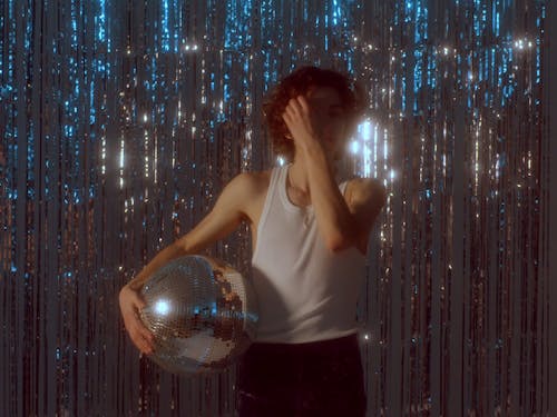 Young Man Holding Disco Ball