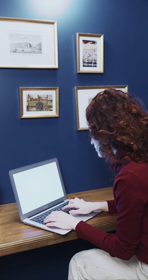 A Woman Finishing Her Work With A Laptop