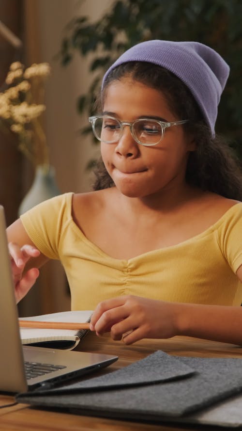 A Young Student Attending Her Online Classes