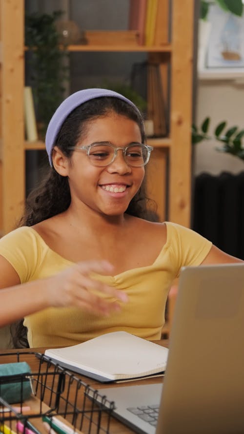 A Young Girl Attending Her Online Classes