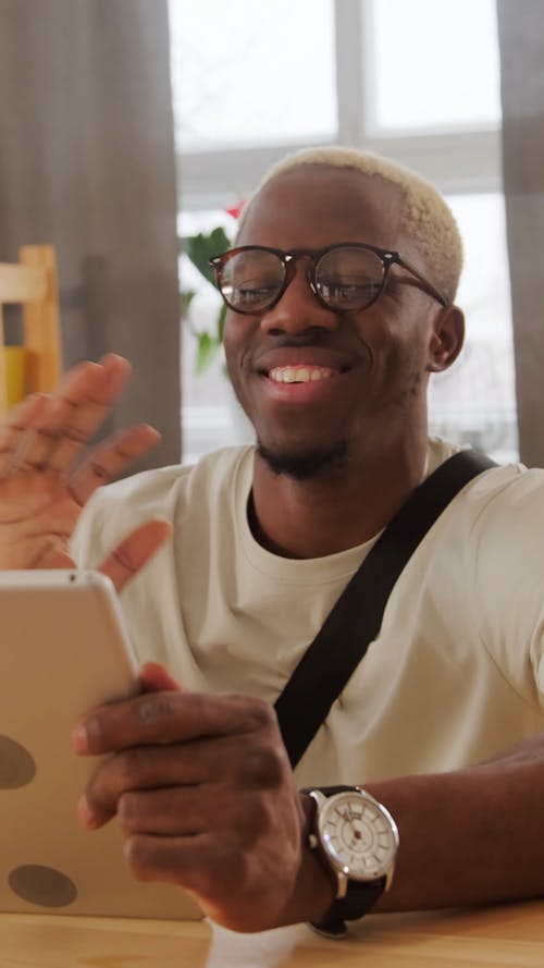 A Man Communicating Using a Tablet