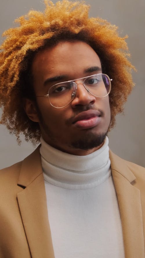 Man With Eyeglasses Looking Pensive at the Camera