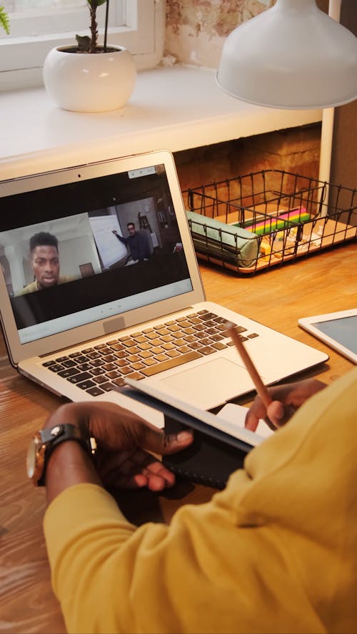 A Young Man Attending Online Classes