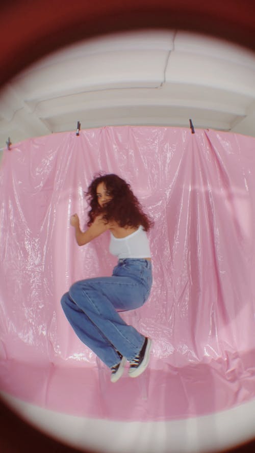 A Young Woman Spinning on a Bar Stool