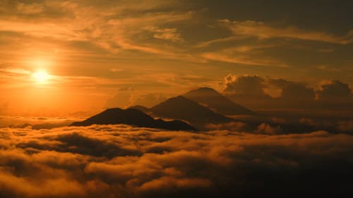 Sea of Clouds and Mountains During Golden Hour