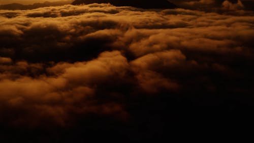 Sea of Clouds and Mountains During Golden Hour