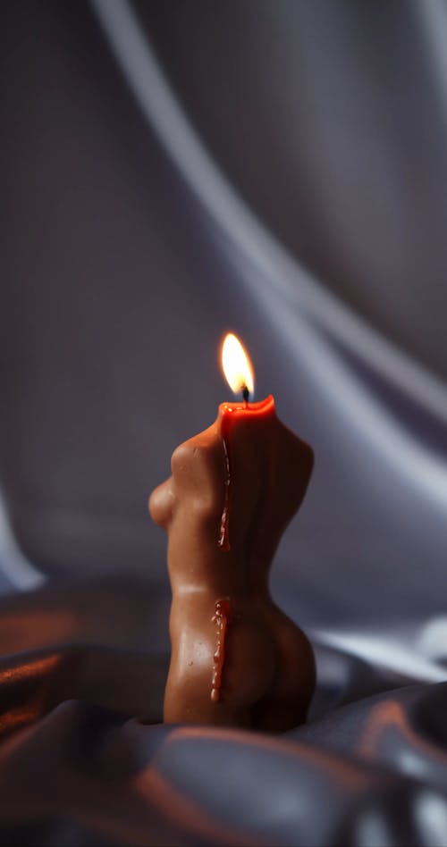 Close-Up View of a Lighted Candle