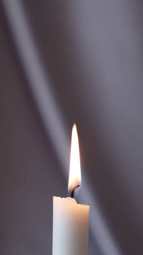Close-Up View of a Lighted Candle