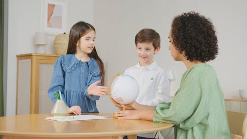 Woman Teaching Kids about Geography