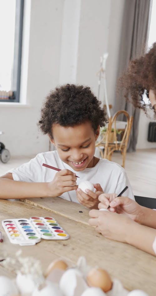 A Child Drawing on an Egg