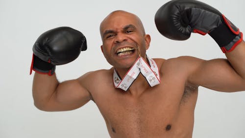 A Boxer Biting a Medal