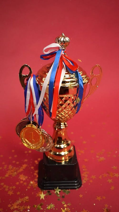 A Gold Trophy with Falling Confetti