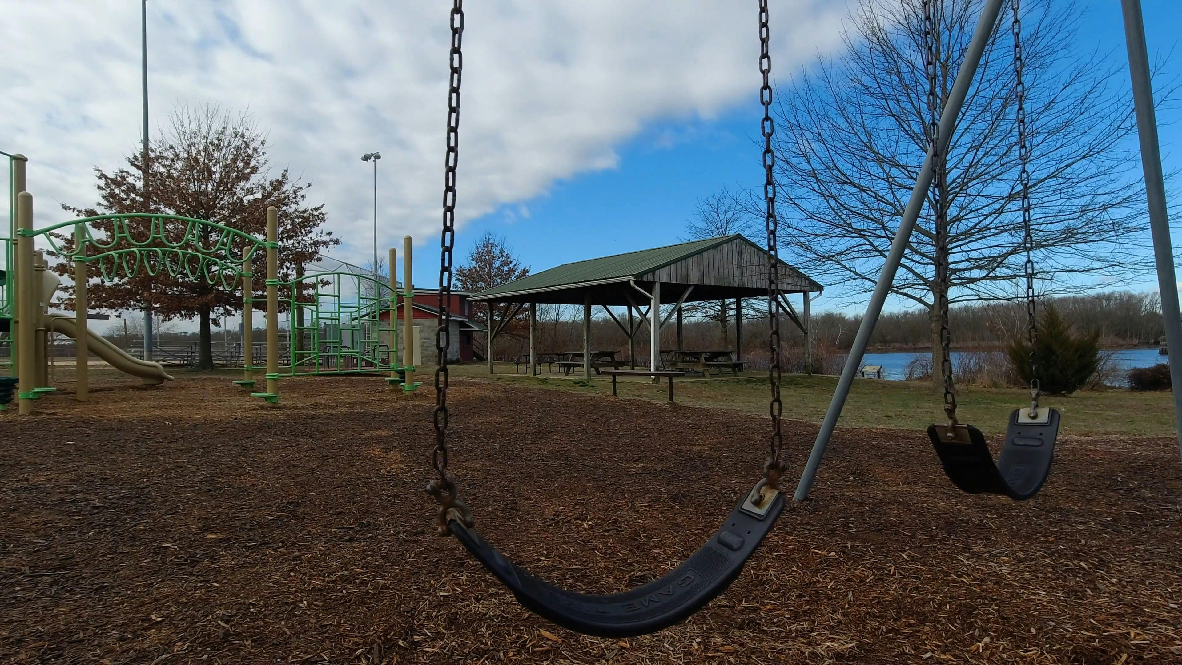 Empty Swings in the Playground · Free Stock Video