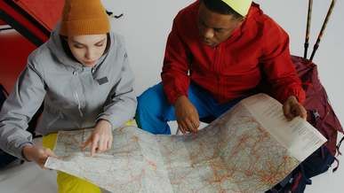 travelers searching in their map