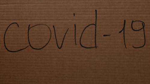 COVID-19 Written on a Cardboard