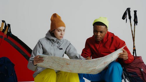 Man and Woman Looking at a Map