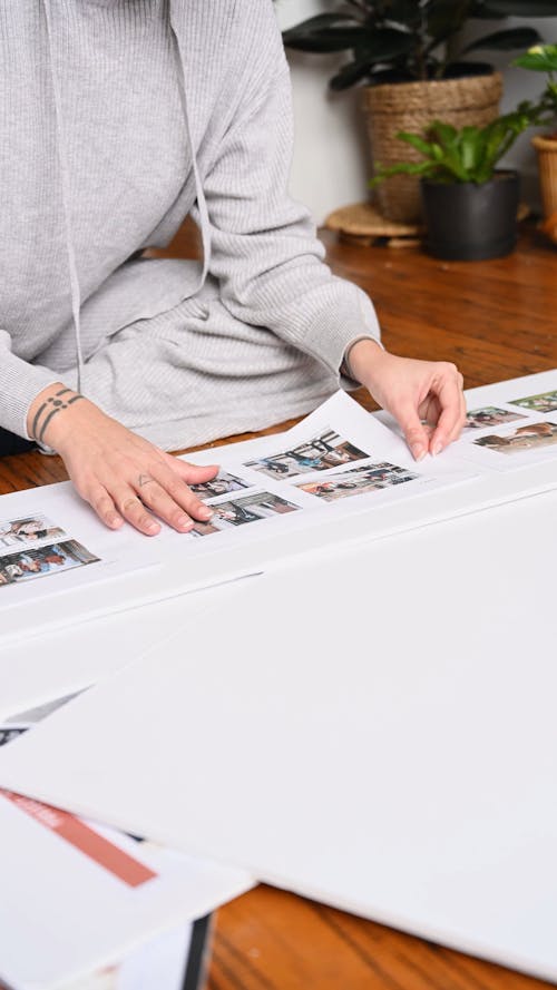 Sticking Pictures on a White Cardboard