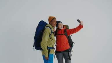 two people recording a video using a cellphone