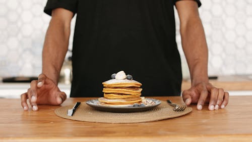 A Plate of Pancakes on a Wooden Table