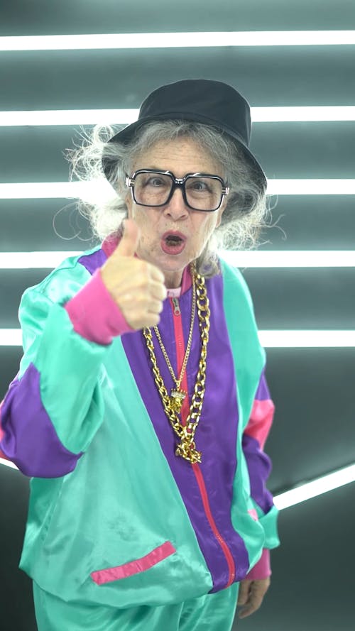 An Elderly Woman Giving The Thumbs Up