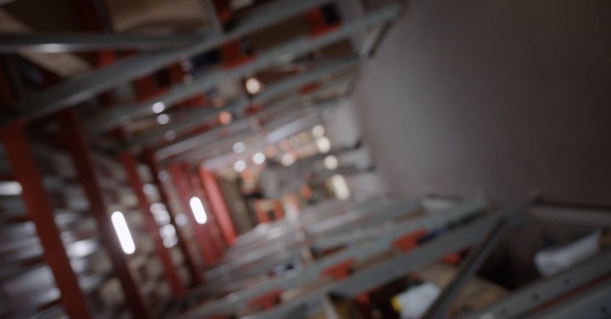 Woman Model while Standing in an Aisle in Between the Racks Free Stock ...