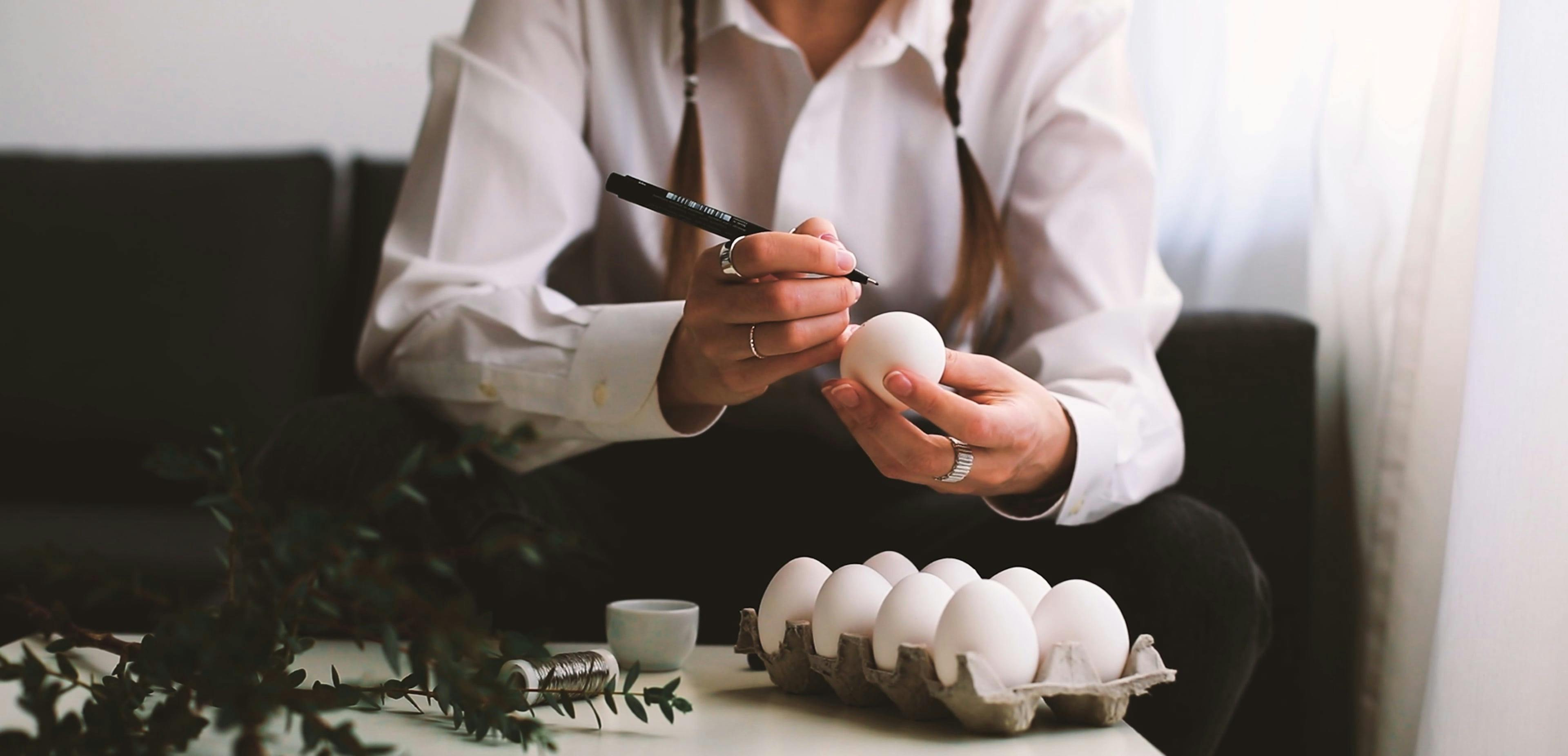 A Person Drawing a Face on an Egg Free Stock Video Footage, Royalty