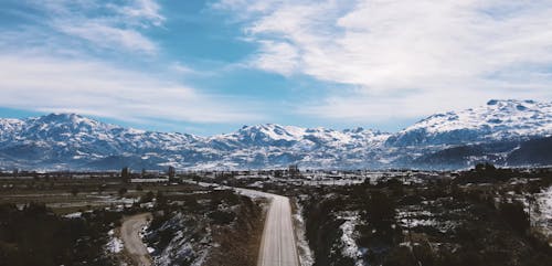 Drone Footage of Snow Capped Mountain Ranges