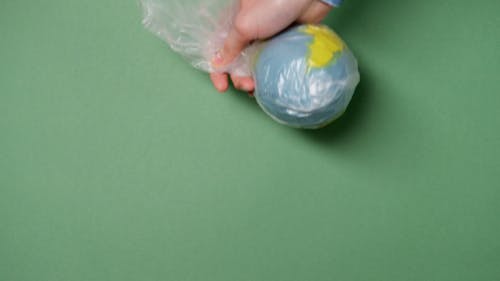 Paper Model of Earth Inside a Plastic Bag