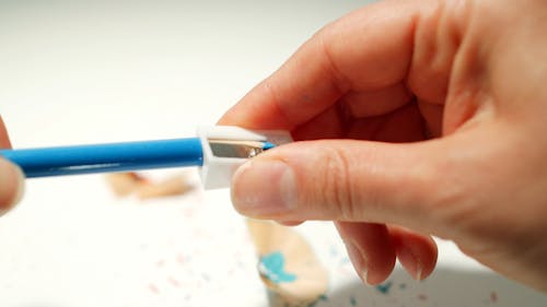 A Person Sharpening a Pencil