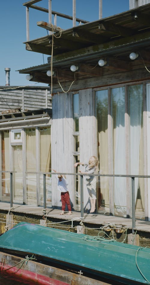 Children Playing and Throwing to the River