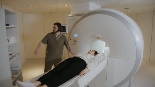 A Sonographer Medically Scanning A Patient