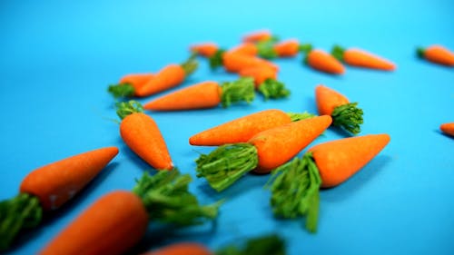 Mini Carrots on a Blue Background
