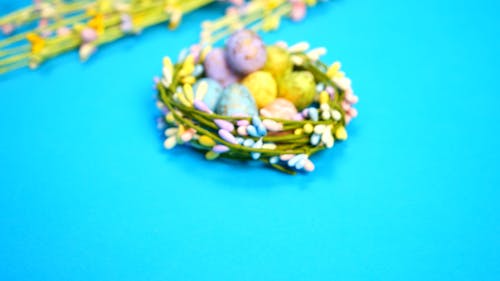 Easter Eggs on a Nest with a Blue Background
