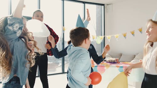 Kids Jumping in a Birthday Party