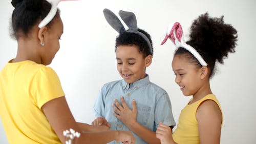 A Girl Giving Chocolate Eggs to Her Friends