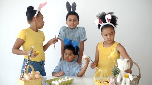 Kids Painting the Easter Eggs