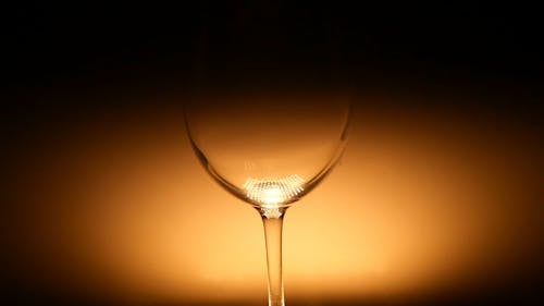 Pouring of Red wine on a Glass