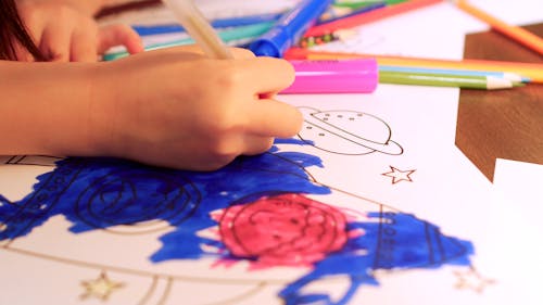Close-Up Video of a Kid Coloring