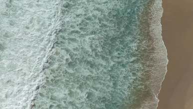 saw waves crashing the beach shore