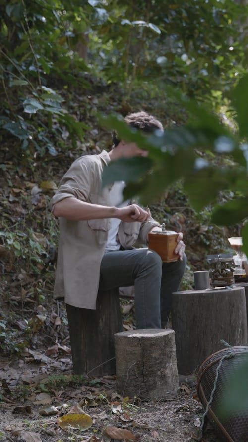 Person Grinding Coffee Beans